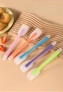 Set of five colorful mini silicone spatulas for cake baking and cream mixing