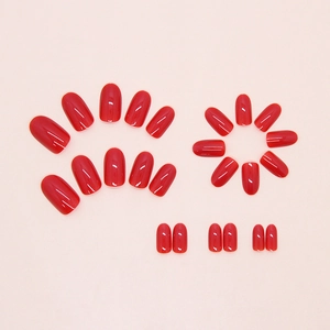 Glossy red press-on nails set of 24 pieces with a vibrant polished finish in multiple sizes