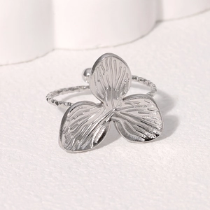 Minimalist leaf ring in silver stainless steel with brushed flower petals and twisted band