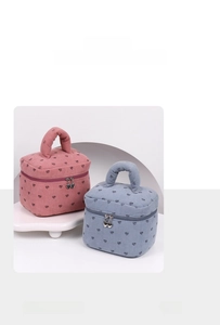 Detailed corduroy texture of heart pattern makeup bags with heart-shaped metal zippers