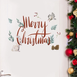 Christmas door decals with Merry Christmas lettering, rabbit and bird on a white door