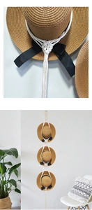 Detail of bohemian handmade woven cotton rope hat organizer with three straw hats on white wall