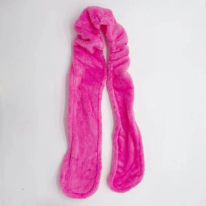 Detail showing soft pink velvet texture of the heatless hair curler for overnight curls