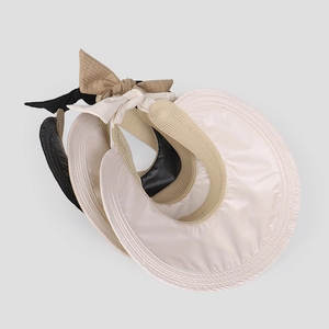 Detail of three colors sun visors with nylon fabric and back bow adjustment