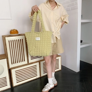 Light green bubble texture tote bag showing spacious capacity and soft fabric detail