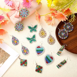 DIY diamond painting earrings in multiple shapes displayed on a floral gift background