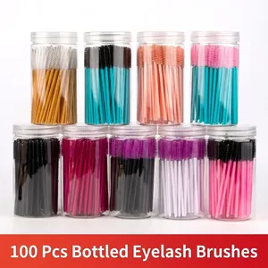 Bulk 100-pack disposable spiral eyelash brushes in colorful tubes with clear storage bottles