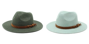 Detail of wide brim straw fedoras with brown leather band and bohemian tassels