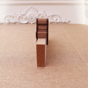Detail of wooden Christmas countdown calendar showing textured layers and natural finish