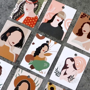 Artistic abstract female portraits printed on jewelry display cards with hanging holes