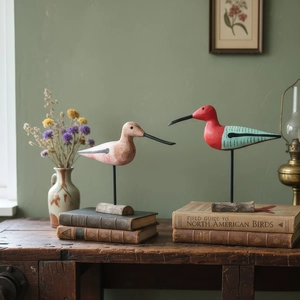 Handcrafted Nordic style painted wooden bird figurines on rustic stands for home decor