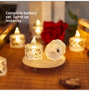Detail of LED candle base showing the black power switch and button battery compartment