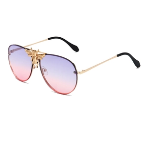 Rimless aviator sunglasses with gold bee detail and gradient purple pink lenses