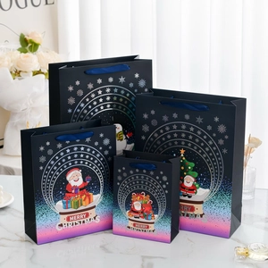 Set of four blue Merry Christmas gift bags with elegant gold foil Santa Claus patterns