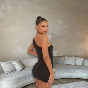 Slim fit black one-shoulder mini dress with rhinestone bow detail and side slit design