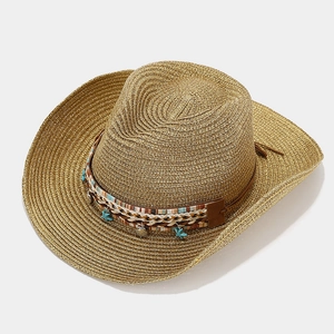 Bohemian woven straw Panama hat with shell and turquoise star charms shown at a 45-degree angle
