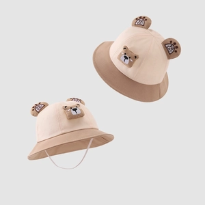 Detail of baby bucket hat with 3D bear ears, two-tone canvas and chin strap tie