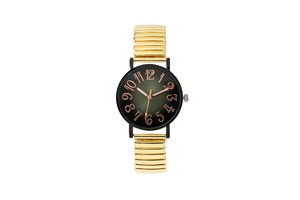Detail of quartz watch featuring black gradient dial with gold elastic expansion band