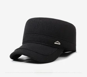 Side detail of black wool flat top military cap with metal peak logo and textured fabric