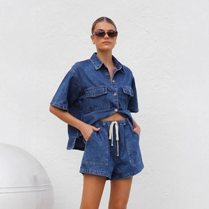 Outdoor street style of women's blue denim short-sleeve shirt and drawstring shorts set