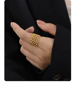 Detailed view of wide 18K gold-plated honeycomb ring with sparkling diamond accents