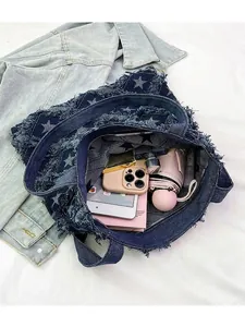 Retro denim tote bag with star print and fringe detailing featuring a large capacity