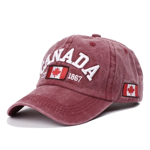 Detail of vintage washed burgundy baseball cap featuring premium 3D Canada leaf embroidery
