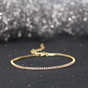 Macro shot of 18k gold plated s925 silver tennis bracelet with pink cubic zirconia stones
