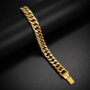 Close-up of polished 10mm gold Cuban link chain bracelet for men on black background