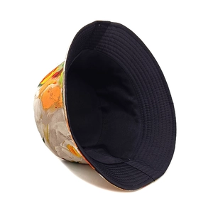 Detail of floral bucket hat showing colorful print exterior and black reversible lining