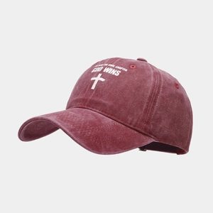 Detail of burgundy washed cotton baseball cap with God Wins white printed text