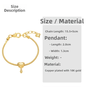 Detailed view of gold heart charm bracelet with 'MOM' engraving and size measurements