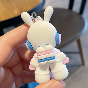 Cute astronaut bunny keychain accessory with white soft silicone and colorful details