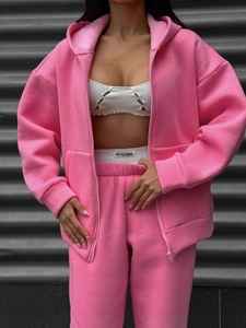 Women pink zip hooded sweatshirt and matching sweatpants set with a white crop top