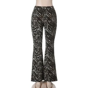 Close-up of animal print flared pants with sparkling rhinestone detail and tiger stripes