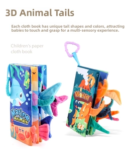 Detail of baby cloth books with 3D animal tails, ocean and dinosaur themes for sensory play