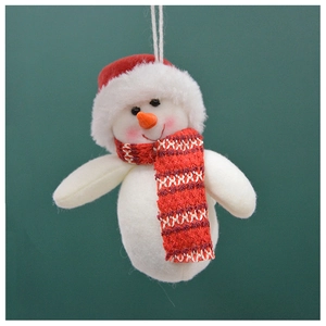 Detail of plush snowman ornament with red hat and orange nose for Christmas tree