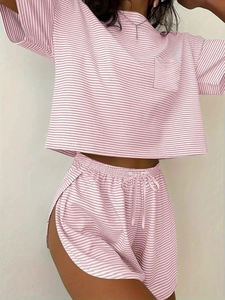 Detail of pink and white striped two-piece lounge set with drawstring waist and pocket