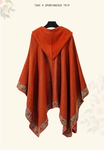 Detail of knit hooded poncho with ethnic geometric patterns and rustic texture