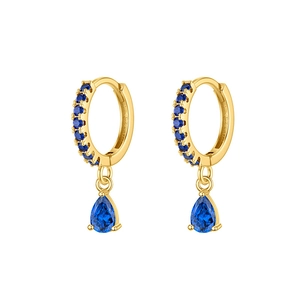 Gros plan détaillé de boucles d'oreilles dorées avec zircons bleu foncé en poire