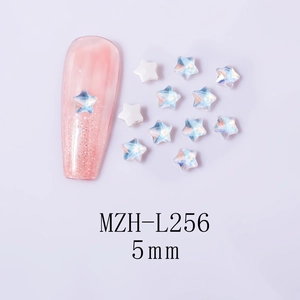 Close-up of 5mm aurora star nail art charms with iridescent effect on a pink glitter nail