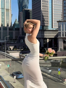 Elegant white sleeveless bodycon maxi dress with ruching and high slit for summer