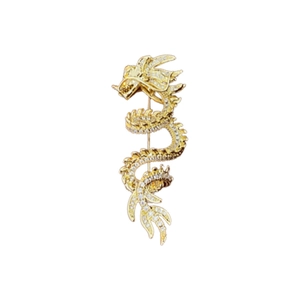Exquisite gold-plated dragon brooch with white crystals on a clean white background