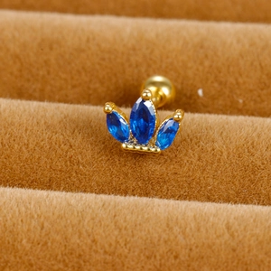 Macro detail of royal blue marquise zircon flower crown earring with gold screw ball back