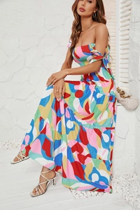 Detail of colorful abstract print bandeau maxi dress with tiered skirt and lace-up neck