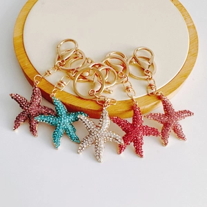 Starfish keychains with colorful rhinestones on a gold metal chain set of five colors