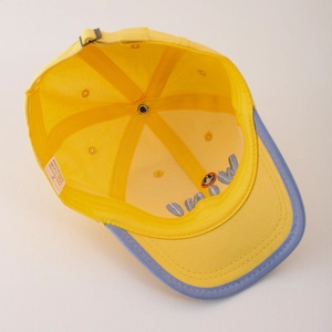 Inside view of cotton baby baseball cap with yellow crown and blue contrast brim