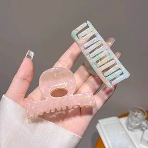 Medium acetate hair claw clips in pink pearl and teal gradient for elegant hairstyles