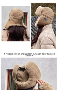 Close-up of beige thermal trapper hat with thick faux fur lining and ear protection