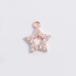 Detailed view of hollow star charm in rose gold with shimmering zircon pave setting